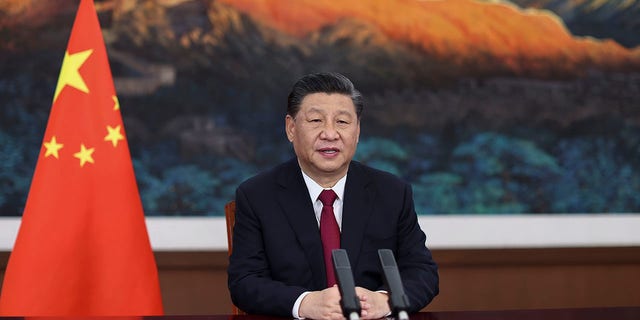 In this photo released by Xinhua News Agency, Chinese President Xi Jinping delivers a keynote speech via video for the opening ceremony of the Boao Forum for Asia (BFA) Annual Conference, in Beijing Tuesday, April 20, 2021. Xi on Tuesday called for more equitable management of global affairs and, in an implicit rejection of U.S. dominance, said governments shouldn't be allowed to impose rules on others. (Ju Peng/Xinhua via AP)