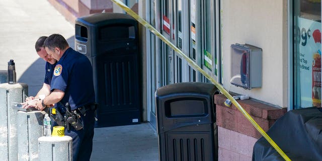 Emergency service personnel work at the scene of a shooting at a Stop & Shop supermarket, Tuesday, April 20, 2021, in West Hempstead, N.Y.