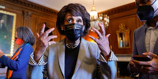 Rep. Maxine Waters, D-Calif., talks on Capitol Hill in Washington on Tuesday, April 20, 2021, as she waits for the verdict to be read in the murder trial of former Minneapolis police Officer Derek Chauvin in the death of George Floyd. (AP Photo/J. Scott Applewhite)