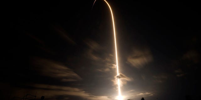 A SpaceX Falcon 9 lifts off in this time exposure from Launch Complex 39A Friday, April 23, 2021, at the Kennedy Space Center in Cape Canaveral, Fla. Four astronauts will fly on the SpaceX Crew-2 mission to the International Space Station. (AP Photo/Chris O'Meara)