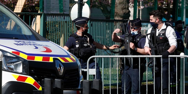 Police officers block the access with barriers next to the police station in Rambouillet, south west of Paris, Friday, April 23, 2021. (AP Photo/Michel Euler)