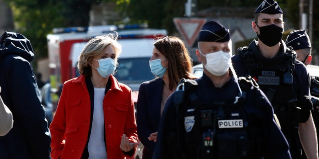 Head of the Ile de France regional council Valerie Pecresse, left, arrives at the Police station in Rambouillet, south west of Paris, Friday, April 23, 2021. (AP Photo/Michel Euler)