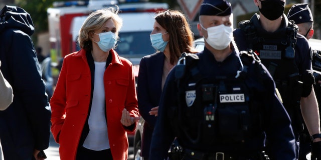 Head of the Ile de France regional council Valerie Pecresse, left, arrives at the Police station in Rambouillet, south west of Paris, Friday, April 23, 2021. (AP Photo/Michel Euler)