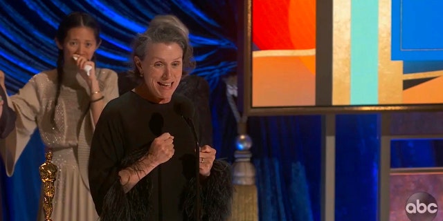 In this video image provided by ABC, Frances McDormand accepts the best picture award for "Nomadland" as director Chloe Zhao looks on at the Oscars on Sunday, April 25, 2021. (ABC via AP)