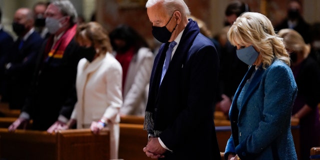 In this Wednesday, Jan. 20, 2021 file photo, President-elect Joe Biden and his wife, Jill Biden, attend Mass at the Cathedral of St. Matthew the Apostle during Inauguration Day ceremonies in Washington. (AP Photo/Evan Vucci)