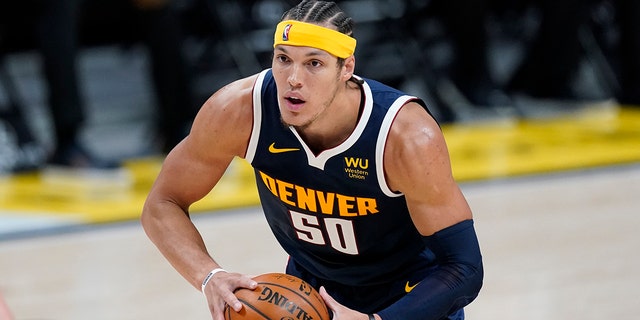 Denver Nuggets forward Aaron Gordon looks to pass the ball during the second half of the team's NBA basketball game against the Orlando Magic on Sunday, April 4, 2021, in Denver.