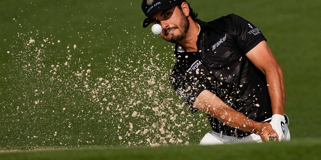 Abraham Ancer, of Mexico, hits out of a bunker on the second hole during the first round of the Masters golf tournament on Thursday, April 8, 2021, in Augusta, Ga. 