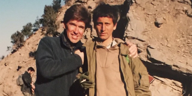 With a young Afghan soldier Tora Bora 2001