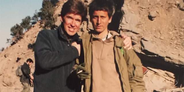 With a young Afghan soldier Tora Bora 2001