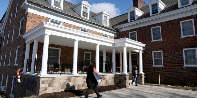 An Albion College student moves into the West Hall dorm for freshman for the start of the Winter semester at the college in Albion, Michigan on Saturday, January 23, 2021.