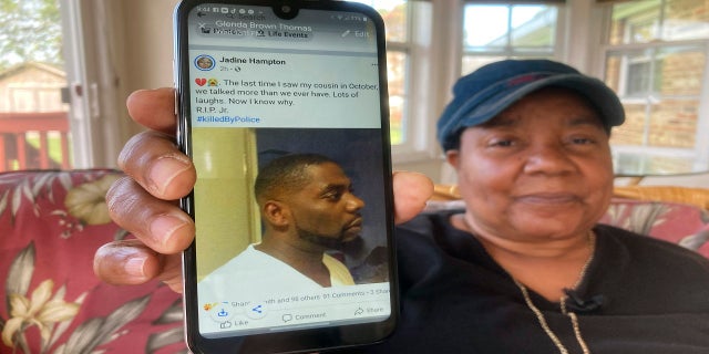 Glenda Brown Thomas displays a photo of her nephew, Andrew Brown Jr., on her cellphone at her home in Elizabeth City, North Carolina, on Thursday. (AP)