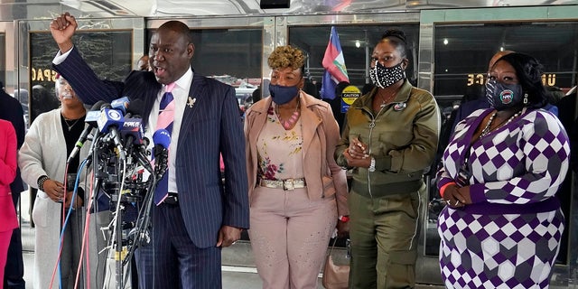 Attorney Ben Crump, foreground, who represents the family of Daunte Wright, speaks at a news conference in New York on Wednesday. He was accompanied by Lesley McSpadden, mother of Michael Brown, left; Gwen Carr, mother of Eric Garner, third left; Sybrina Fulton, mother of Trayvon Martin, fourth left; and Sequette Clark, mother of Stephon Clark. (AP Photo/Richard Drew)