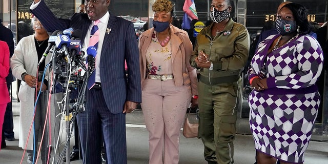 Attorney Ben Crump, foreground, who represents the family of Daunte Wright, speaks at a news conference in New York on Wednesday. He was accompanied by Lesley McSpadden, mother of Michael Brown, left; Gwen Carr, mother of Eric Garner, third left; Sybrina Fulton, mother of Trayvon Martin, fourth left; and Sequette Clark, mother of Stephon Clark. (AP Photo/Richard Drew)