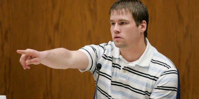 Bobby Dassey, Steven Avery's nephew and the brother of Brendan Dassey, a 17-year old also charged in Tereasa Halbach's death points out Steven Avery in the courtroom to begin his testimony at the Calumet County Courthouse during third day of Steve Avery's trial in his murder case Wednesday, Feb. 14, 2007, in Chilton, Wis. Avery is accused, along with his 17-year-old nephew, of killing Teresa Halbach, 25, after she went to the family's rural salvage lot to photograph a minivan they had for sale. (AP Photo/Sheboygan Press, Bruce Halmo, Pool)