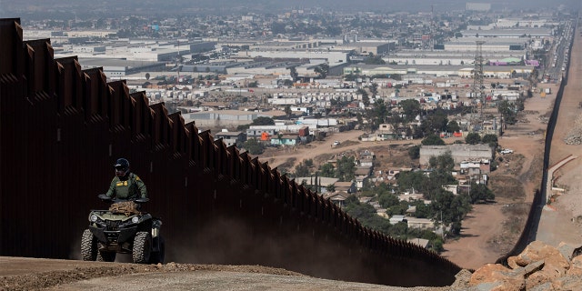 A border patrol agent patrols along a construction site for the secondary border fence which follows the length of the primary border fence that separates the United States and Mexico in the San Diego Sector on August 22, 2019 in San Diego, CA. (Photo by Carolyn Van Houten/The Washington Post via Getty Images)