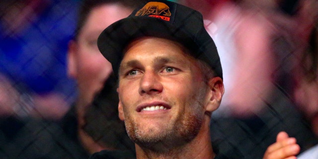 Tampa Bay Buccaneers quarterback Tom Brady watches a UFC 261 mixed martial arts bout, Saturday, April 24, 2021, in Jacksonville, Fla. (Associated Press)