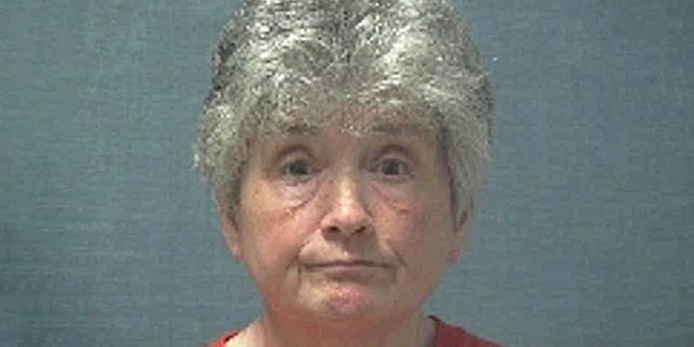 Janet Caplinger allegedly burned down the home she lost to foreclosure.