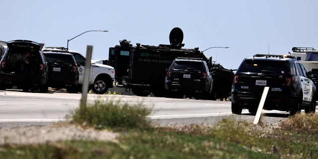 Police officers investigate at the scene where the gunman was killed in Fullerton shootout in Los Angeles, California, the United States, April 27, 2021. (Xinhua/Xinhua via Getty Images)