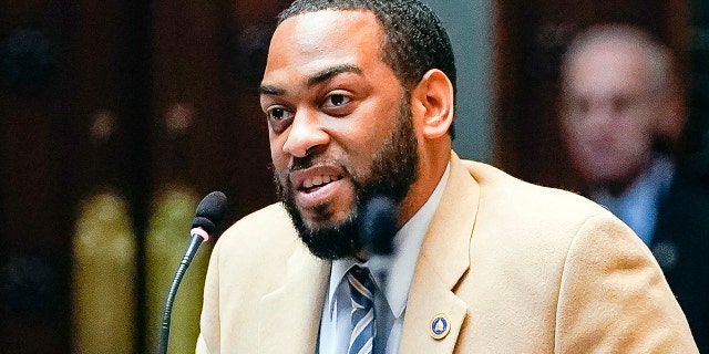 FILE - In this Feb. 19, 2020, file photo, state Rep. Charles Booker advocates for the passage of Kentucky HB-12 on the floor of the House of Representatives in the State Capitol in Frankfort, Ky. (AP Photo/Bryan Woolston, File)