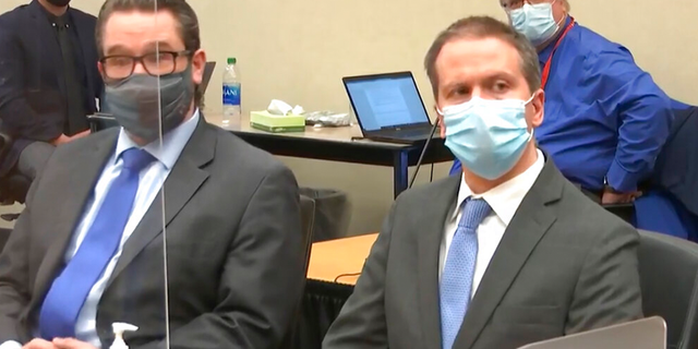 In this image from video, defense attorney Eric Nelson, left, and defendant, former Minneapolis police Officer Derek Chauvin, arrive for the verdict in Chauvin's trial for the 2020 death of George Floyd, Tuesday, April 20, 2021, at the Hennepin County Courthouse in Minneapolis, Minn. 