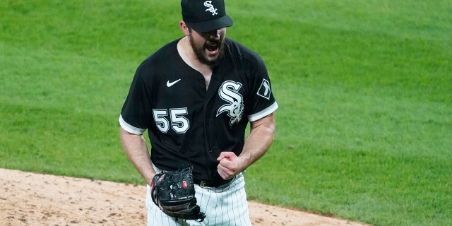 Chicago White Sox starting pitcher Carlos Rodon (55) pumps his fist after striking out Cleveland Indians' Yu Chang (2) to end the sixth inning of a baseball game, Wednesday, April, 14, 2021, in Chicago. (AP Photo/David Banks)