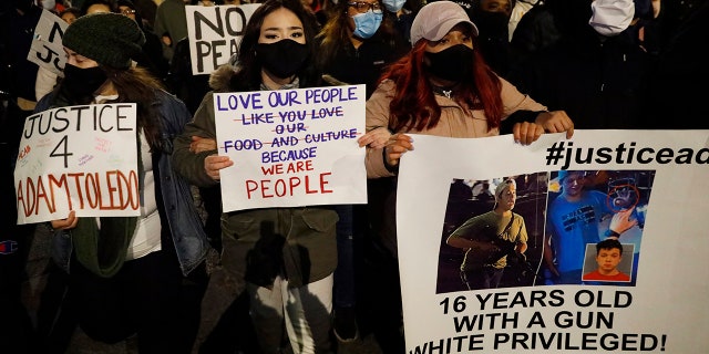 Protesters protest the fatal March shooting by police of 13-year-old Adam Toledo on Friday, April 16, 2021, in the Logan Square area of Chicago. (Associated Press)