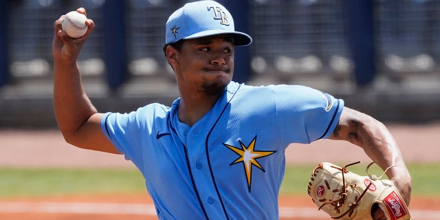 Tampa Bay Rays starting pitcher Chris Archer (22) delivers in the second a spring training baseball game against the Minnesota Twins on Wednesday, March 24, 2021, in Port Charlotte, Fla. (AP Photo/John Bazemore)