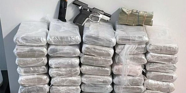 One loaded handgun and more than $200,000 were also recovered from a seventh-floor apartment in a two-building 17 story residential complex containing a gym, lap pool and roof deck.