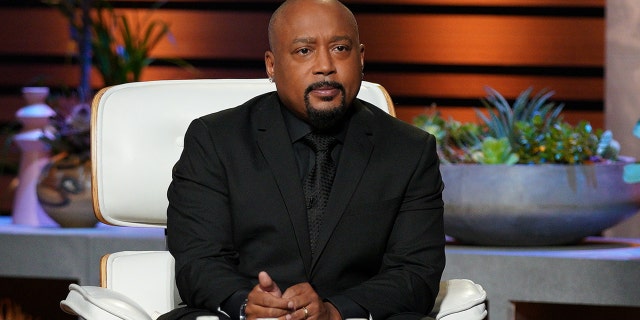 'Shark Tank' star Daymond John explained a controversial tweet praising Louis Farrakhan.