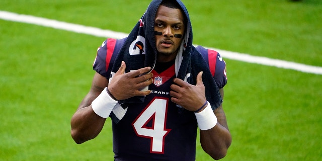 FILE - In this Jan. 3, 2021, file photo, Houston Texans quarterback Deshaun Watson walks off the field before a game against the Tennessee Titans in Houston.