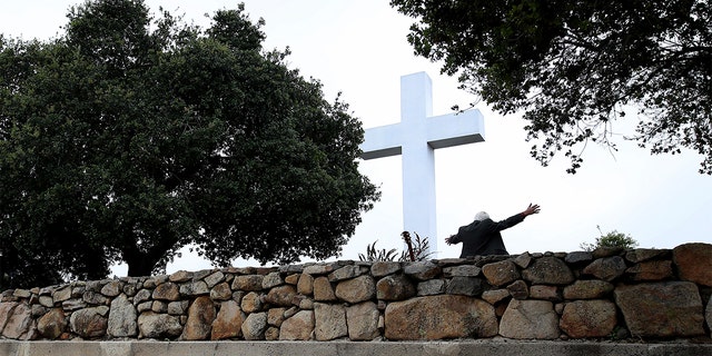 On April 12, 2020, a pastor gives a sermon during a sunrise Easter service outdoors, at Mt. Helix Park in San Diego, California. 
