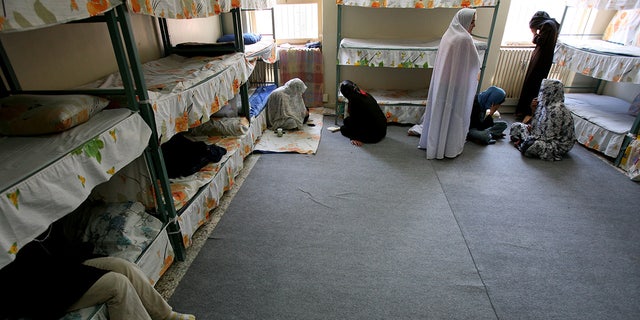 Iranian women prisoners sit inside their cell in Tehran's Evin prison June 13, 2006. Iranian police detained 70 people at a demonstration in favor of women's rights, the judiciary said on Tuesday, adding it was ready to review reports that the police had beaten some demonstrators. 