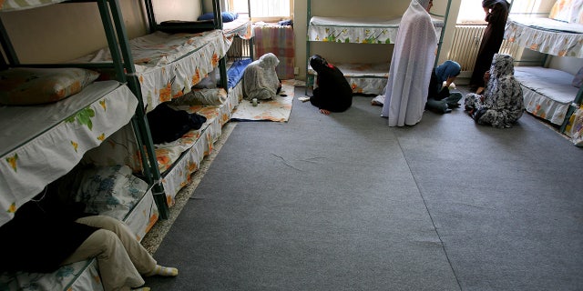 Iranian women prisoners sit inside their cell in Tehran's Evin prison June 13, 2006. Iranian police detained 70 people at a demonstration in favor of women's rights, the judiciary said on Tuesday, adding it was ready to review reports that the police had beaten some demonstrators.