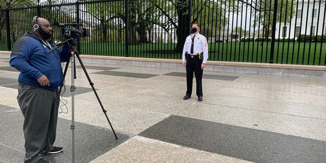 Sgt. Jonathan Stockeland films a message to celebrate veteran Ken Potts' 100th birthday.