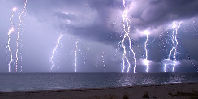 This is a combination of five following 30-second exposures. The view crosses the beach and the Gulf of Mexico from Anna Maria Island, Florida.