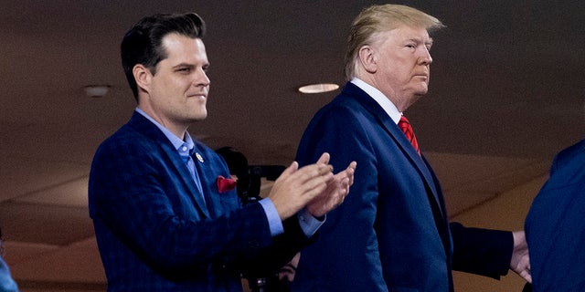 President Trump, right, accompanied by Rep. Matt Gaetz, R-Fla., left, arrive for Game 5 of the World Series baseball game between the Houston Astros and the Washington Nationals at Nationals Park in Washington. (AP Photo/Andrew Harnik)