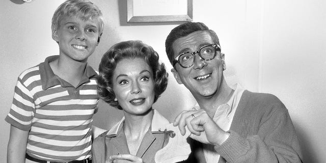 Gloria Henry (center) stars as Alice Mitchell in the CBS sitcom 'Dennis the Menace' with Jay North (left, as Dennis Mitchell) and Herbert Anderson (right, as Henry Mitchell). 
