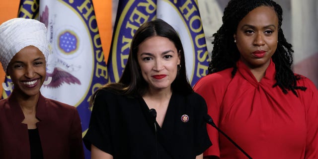 Rep. Alexandria Ocasio-Cortez (D-NY) pauses while speaking as Reps. Ilhan Omar (D-MN) and  Ayanna Pressley (D-MA) listen during a news conference at the U.S. Capitol on July 15, 2019 in Washington, DC. (Photo by Alex Wroblewski/Getty Images)