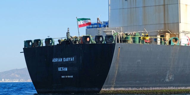 FILE - An Iranian flag flutters on board the Adrian Darya oil tanker, formerly known as Grace 1, off the coast of Gibraltar on August 18, 2019. (Photo by JOHNNY BUGEJA/AFP via Getty Images)