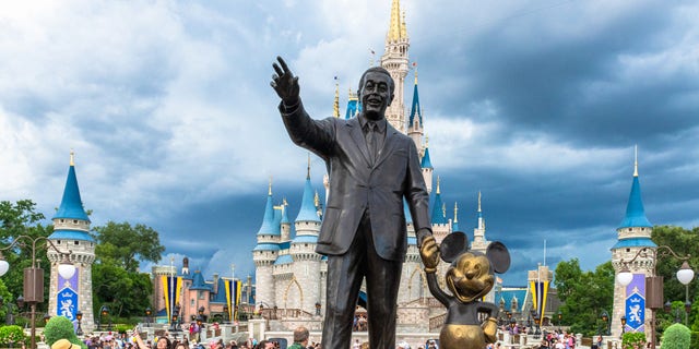 ORLANDO, FLORIDA, UNITED STATES - 2019/07/17: Walt Disney and Mickey Mouse statue inside of the Magic Kingdom theme park . The Cinderella castle can be seen in the background. (Photo by Roberto Machado Noa/LightRocket via Getty Images)