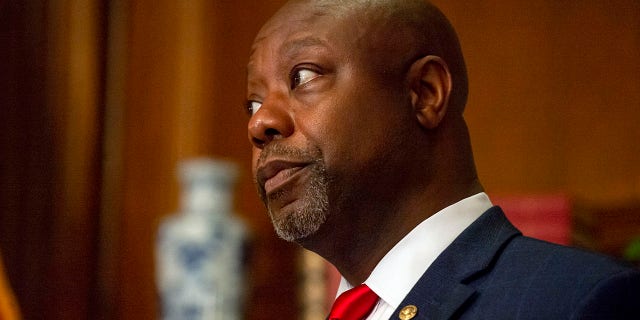 U.S. Sen. Tim Scott, R-S.C., poses before a meeting with Justice Amy Coney Barrett during her confirmation process on Sept. 29, 2020, in Washington, D.C. Scott will deliver the Republican response to President Biden's address to a joint session of Congress on Wednesday. Barrett will not be in attendance -- Chief Justice John Roberts is the only Supreme Court justice invited to the speech. (Bonnie Cash-Pool/Getty Images)