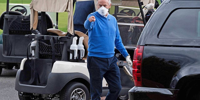 Counselor to the president Steve Ricchetti gestures after a round of golf with President Biden at Wilmington Country Club in Delaware on April 17, 2021. 