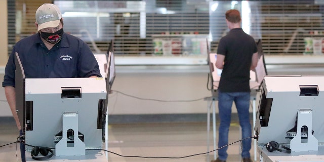 Voters cast their ballots at American Airlines Center Nov. 3, 2020 in Dallas. (Photo by Tom Pennington/Getty Images)