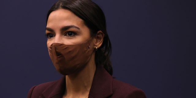 U.S. Rep. Alexandria Ocasio-Cortez (D-NY) listens during a news conference to introduce the "Puerto Rico Self-Determination Act of 2021." (Photo by Alex Wong/Getty Images)