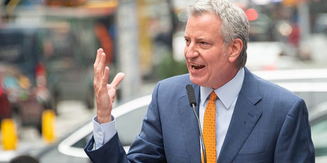 Former Mayor of New York City Bill de Blasio speaks during the opening of a vaccination center for Broadway workers in Times Square April 12, 2021, in New York City. 