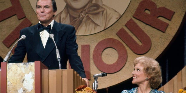 Peter Marshall (seen here at 'The Dean Martin Celebrity Roast' for Betty White), hosted 'The Hollywood Squares' for 15 years.
