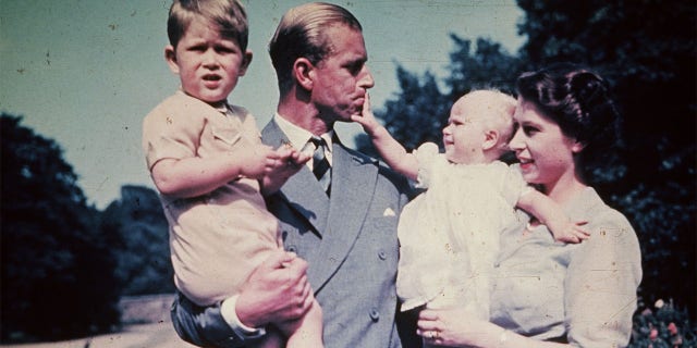 Princess Elizabeth with her husband Prince Philip, Duke of Edinburgh, and their children Prince Charles and Princess Anne, August 1951.