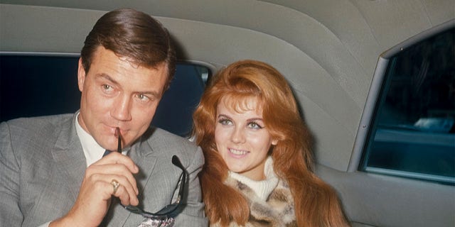 Roger Smith and Ann-Margret in the back of a limo; circa 1970; New York.
