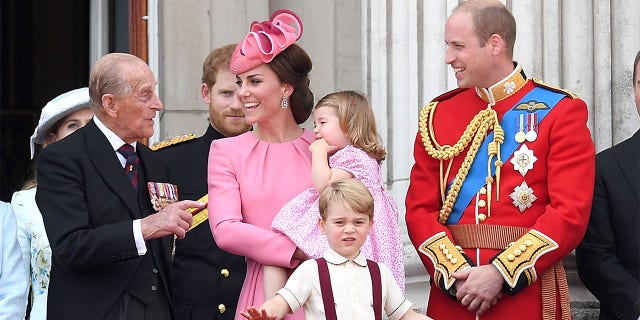 Prince Philip, Duke of Edinburgh, Catherine, Duchess of Cambridge, Princess Charlotte of Cambridge, Prince George of Cambridge and Prince William, Duke of Cambridge look on from the balcony during the annual Trooping The Colour parade at the Mall on June 17, 2017, in London, England.