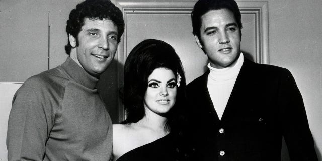 Elvis Presley (R) and Tom Jones pose for a portrait with Elvis' wife Priscilla Beaulieu Presley on April 7, 1968, in Las Vegas, Nevada.